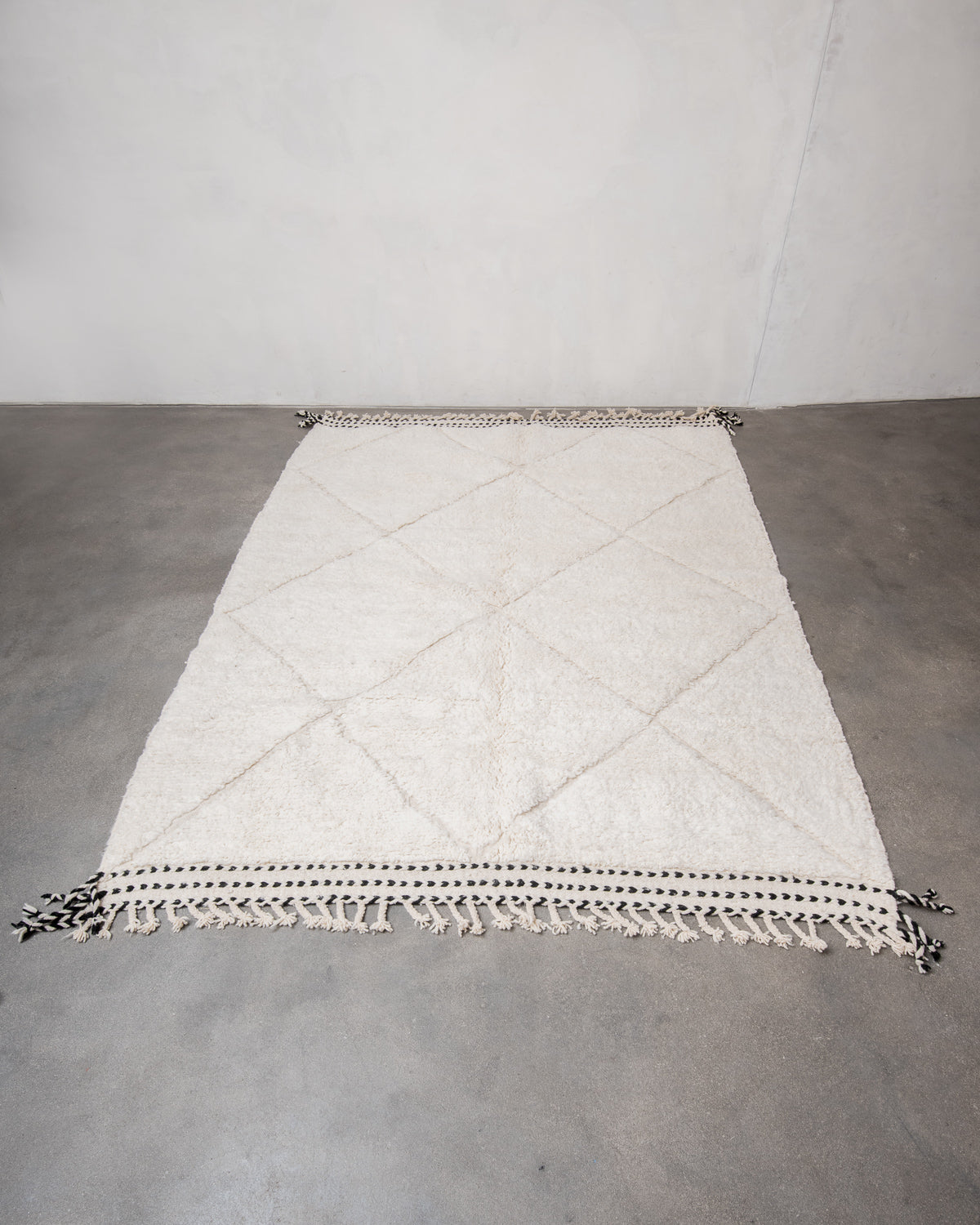 Modern, designer, handcrafted Berber rug from Morocco. Beniourain carpet with minimalist design, natural wool pile and a fluffy texture.